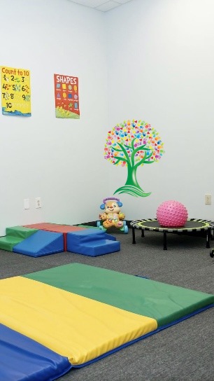 Physical Therapy Room at Little Dreamers PPEC with mini trampoline and mats